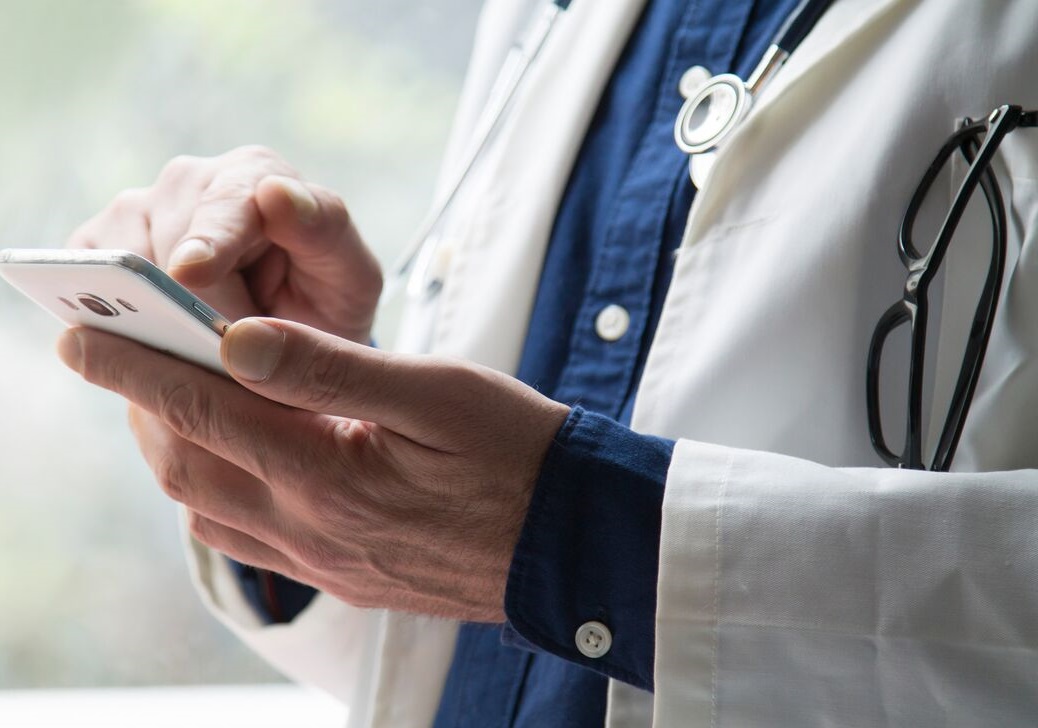 large _ high res-Doctor-checking-phone cropped